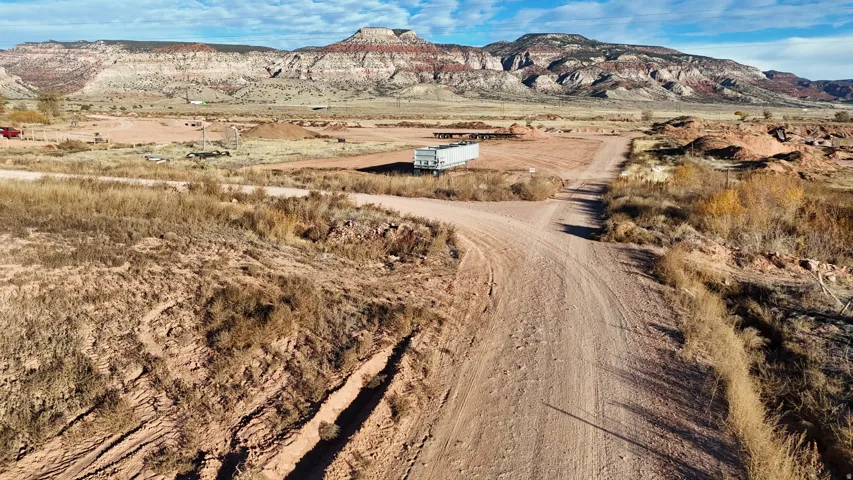 Expansive arid landscape featuring natural terrain and distant mountain ranges