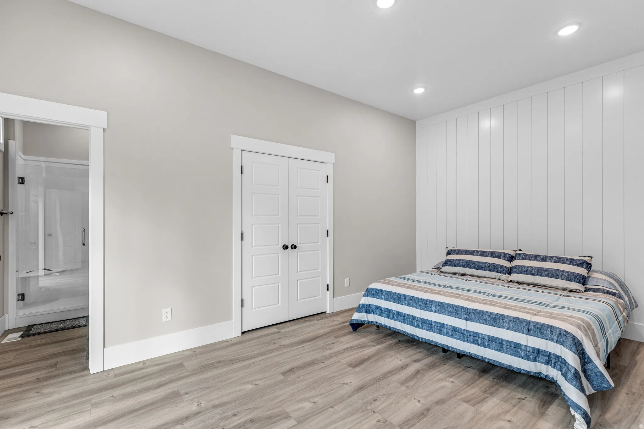 Bedroom featuring light wood-style flooring and recessed lighting