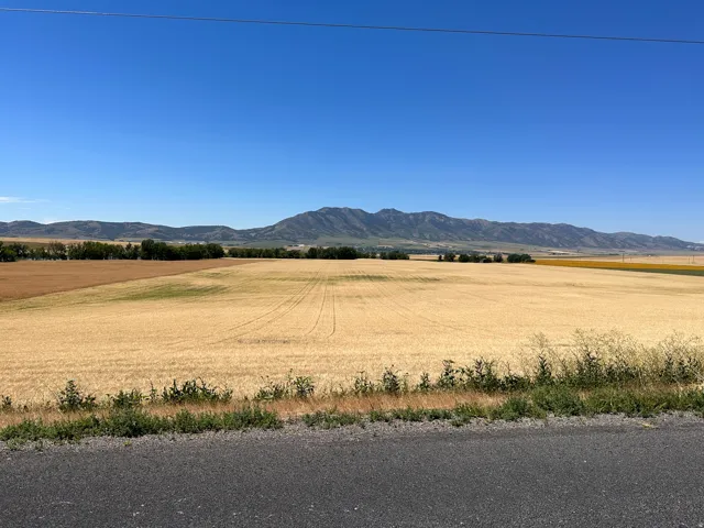 View of mountain background featuring rural landscape