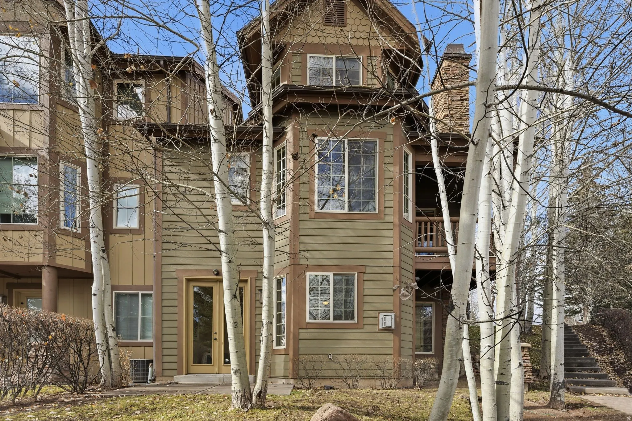 Back of property featuring a balcony