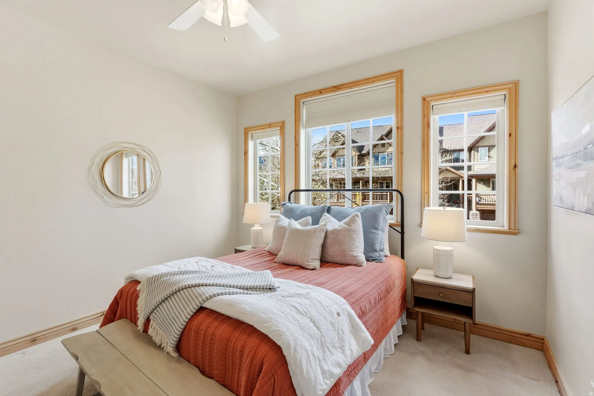 Bedroom with ceiling fan and carpet floors
