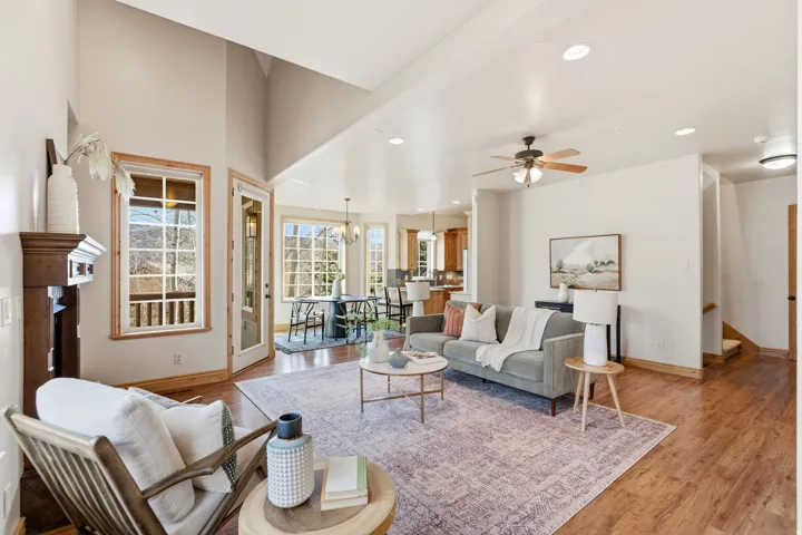 Living area featuring a chandelier, light wood finished floors, recessed lighting, and ceiling fan