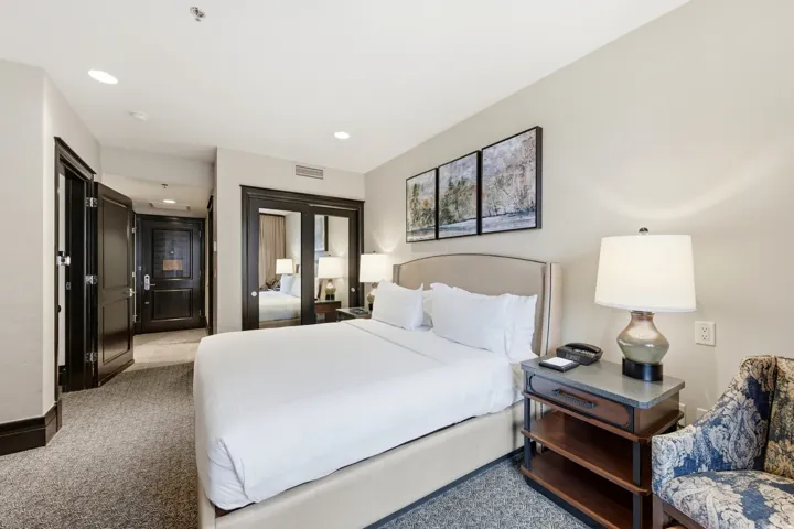 Bedroom featuring a closet, recessed lighting, and light carpet