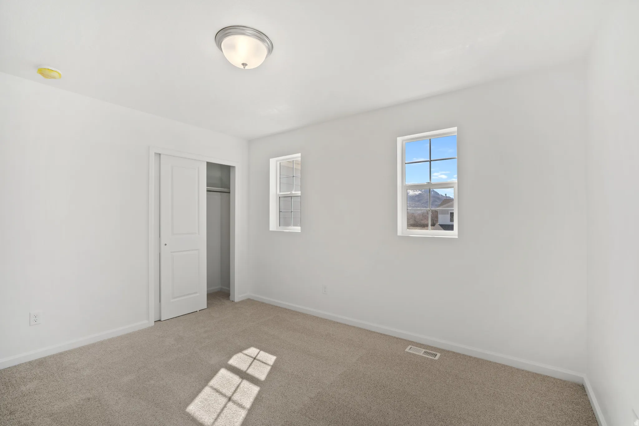 Unfurnished bedroom with a closet and carpet