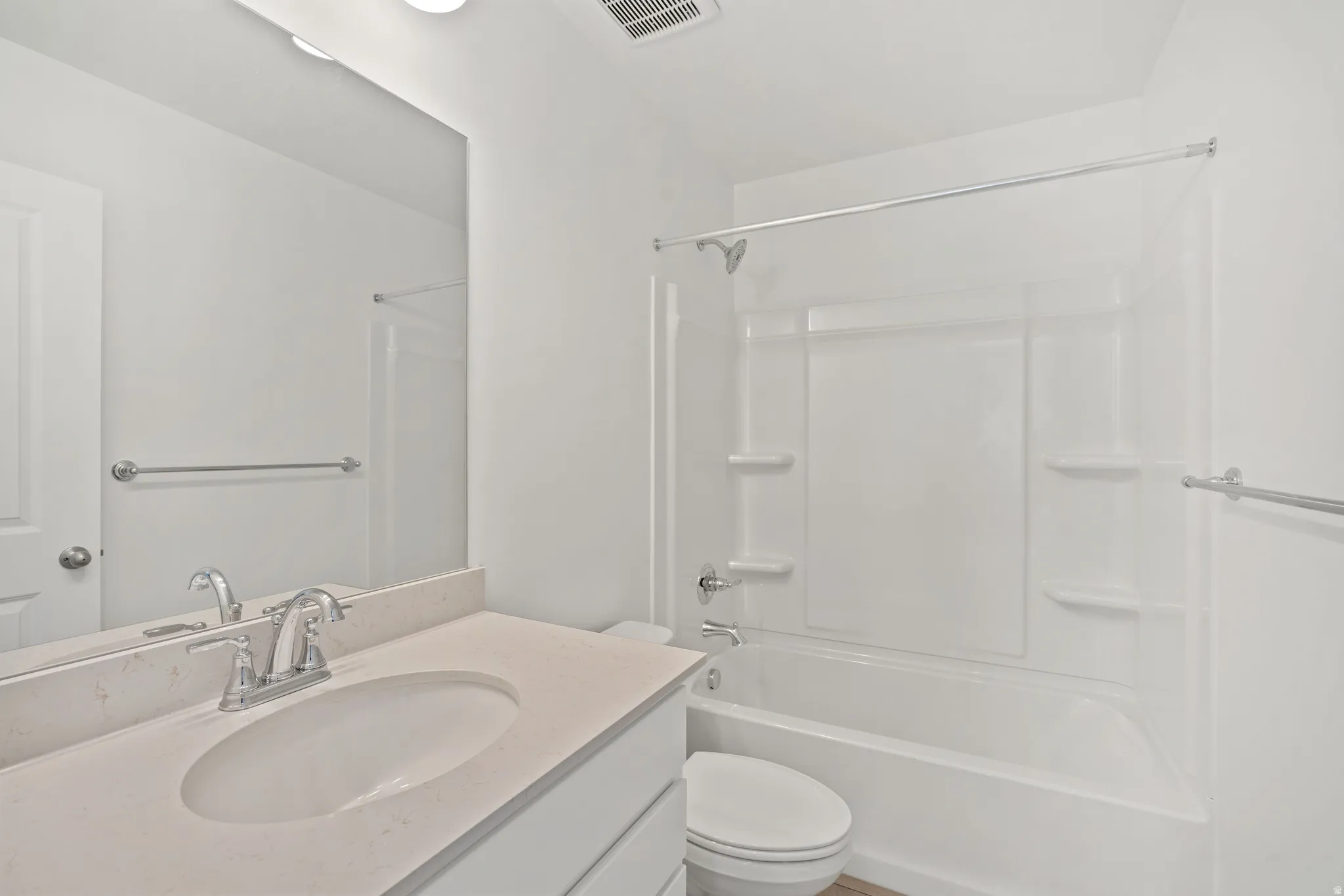 Bathroom featuring vanity and bathing tub / shower combination