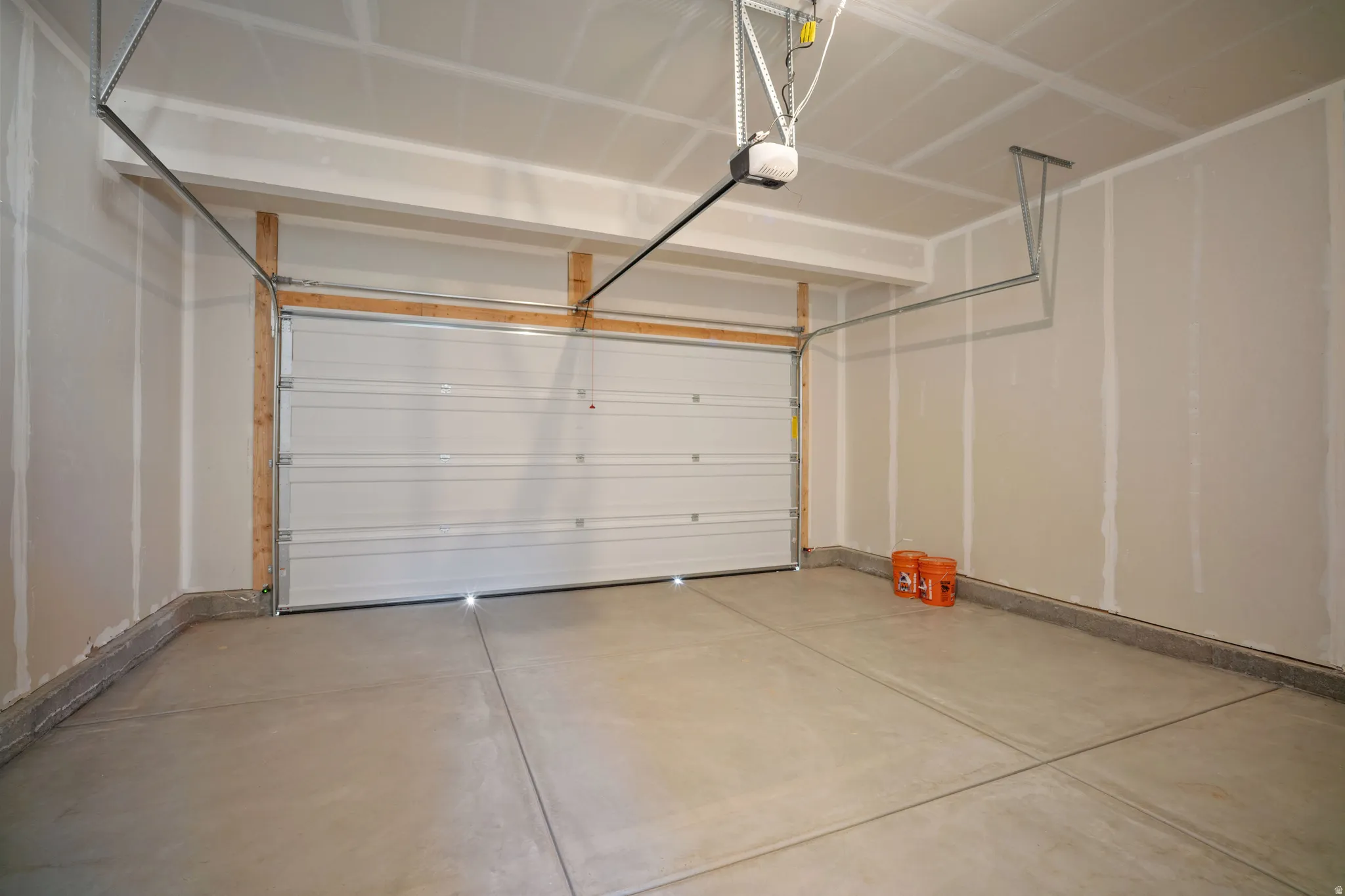 Garage featuring baseboards