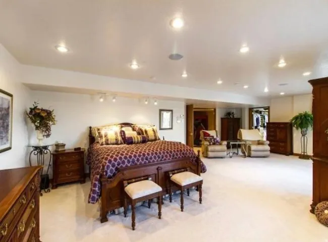 Bedroom with light colored carpet