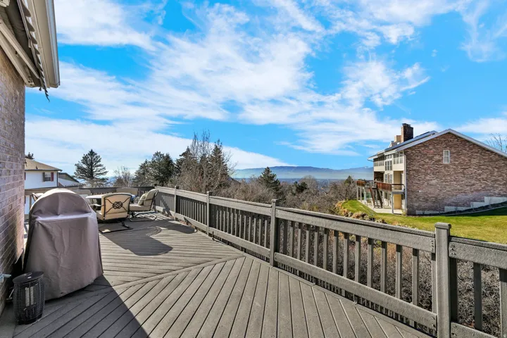 Wooden terrace with a mountain view and grilling area