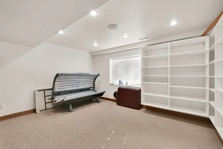 Sitting room featuring light carpet, recessed lighting, and a textured ceiling