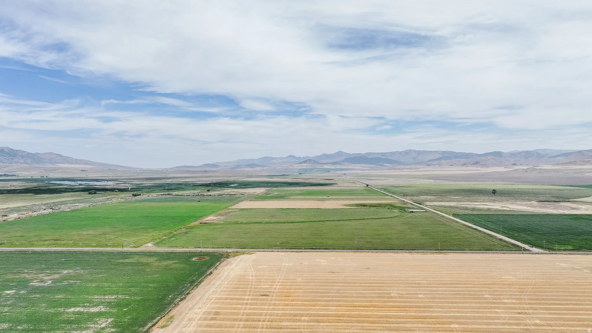 Overview of rural landscape with a mountainous background