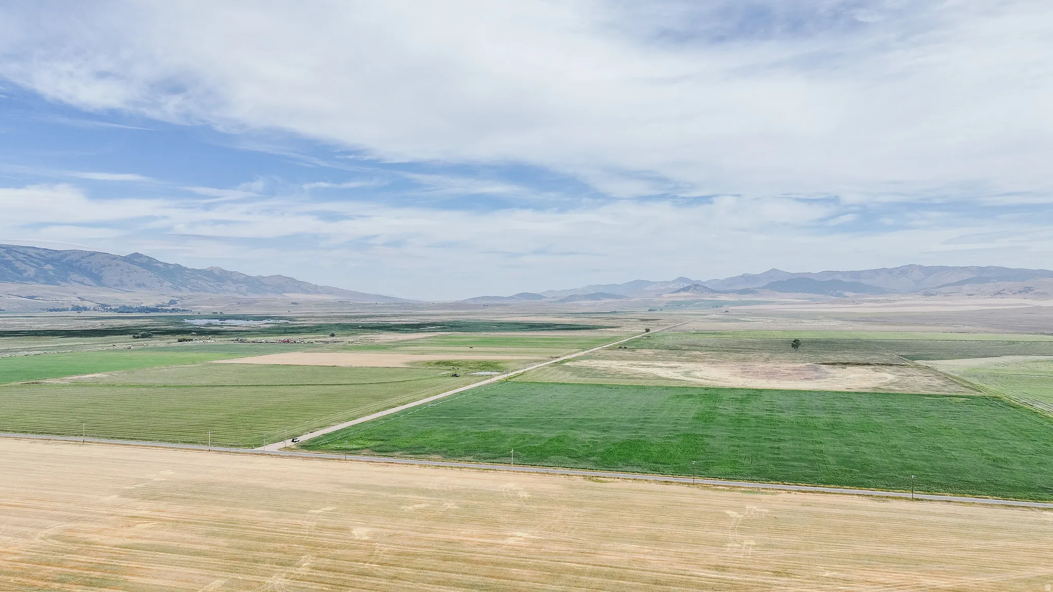 View of mountain backdrop featuring rural landscape