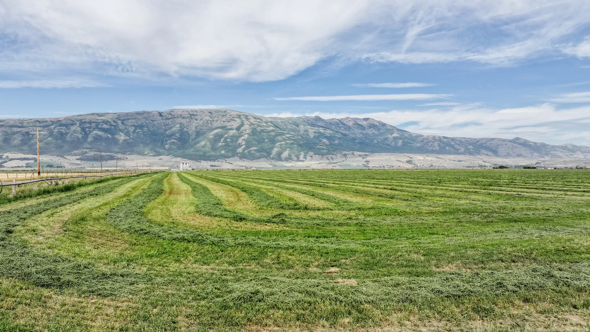 View of mountain backdrop featuring rural landscape