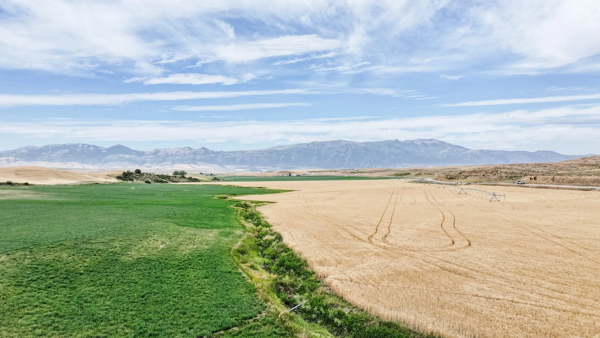 View of mountain background featuring rural landscape
