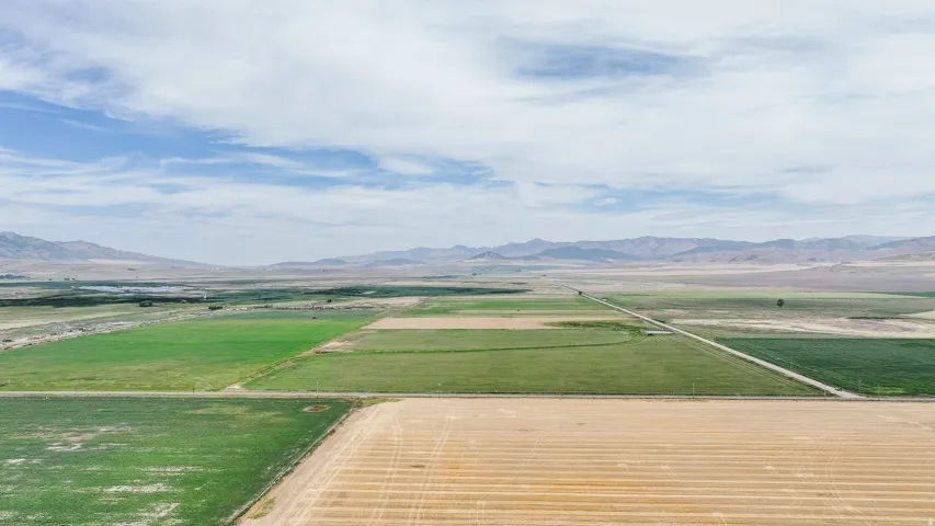 Overview of rural landscape with a mountainous background