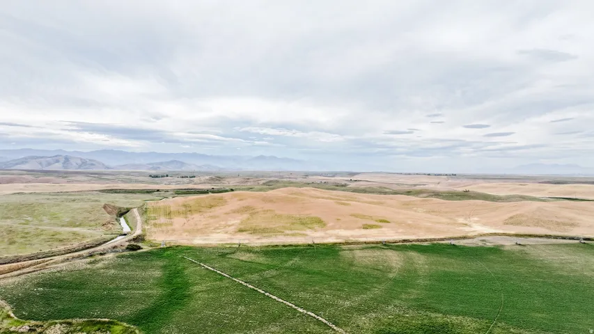 Overview of rural landscape with a mountainous background