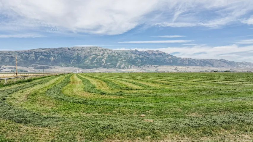 View of mountain backdrop featuring rural landscape
