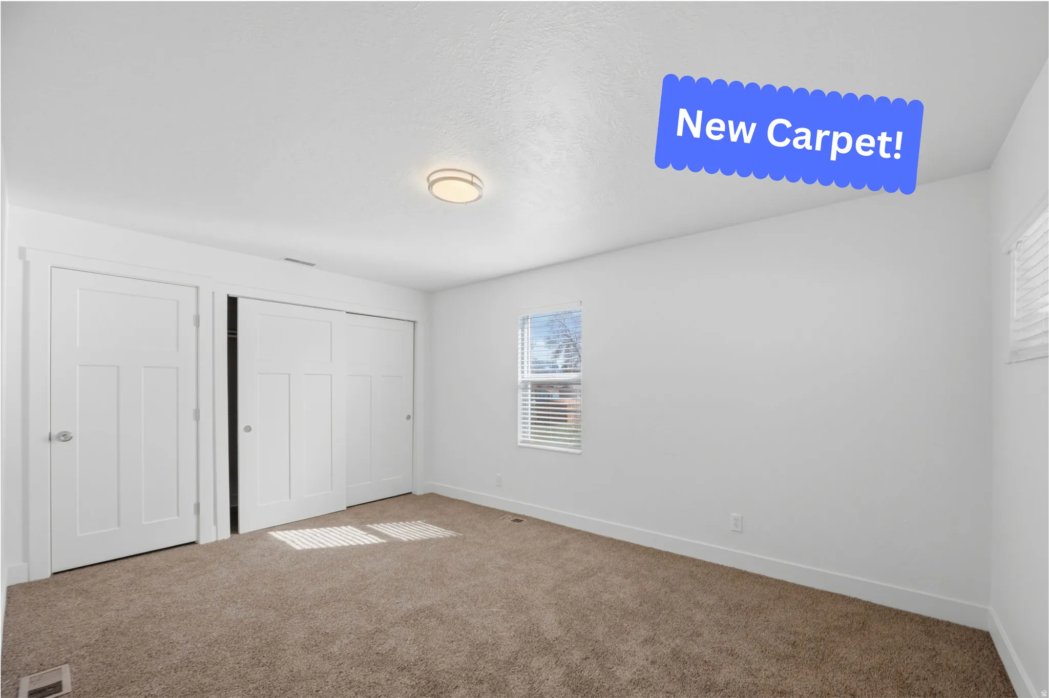 Unfurnished bedroom featuring carpet flooring and a closet