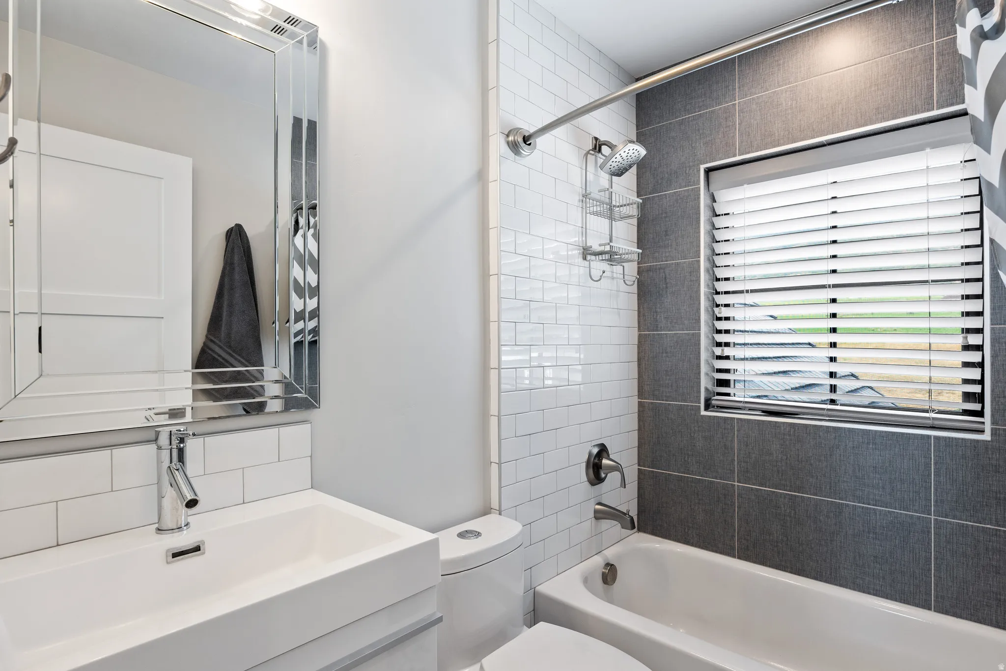 Full bath with tub / shower combination, backsplash, and vanity