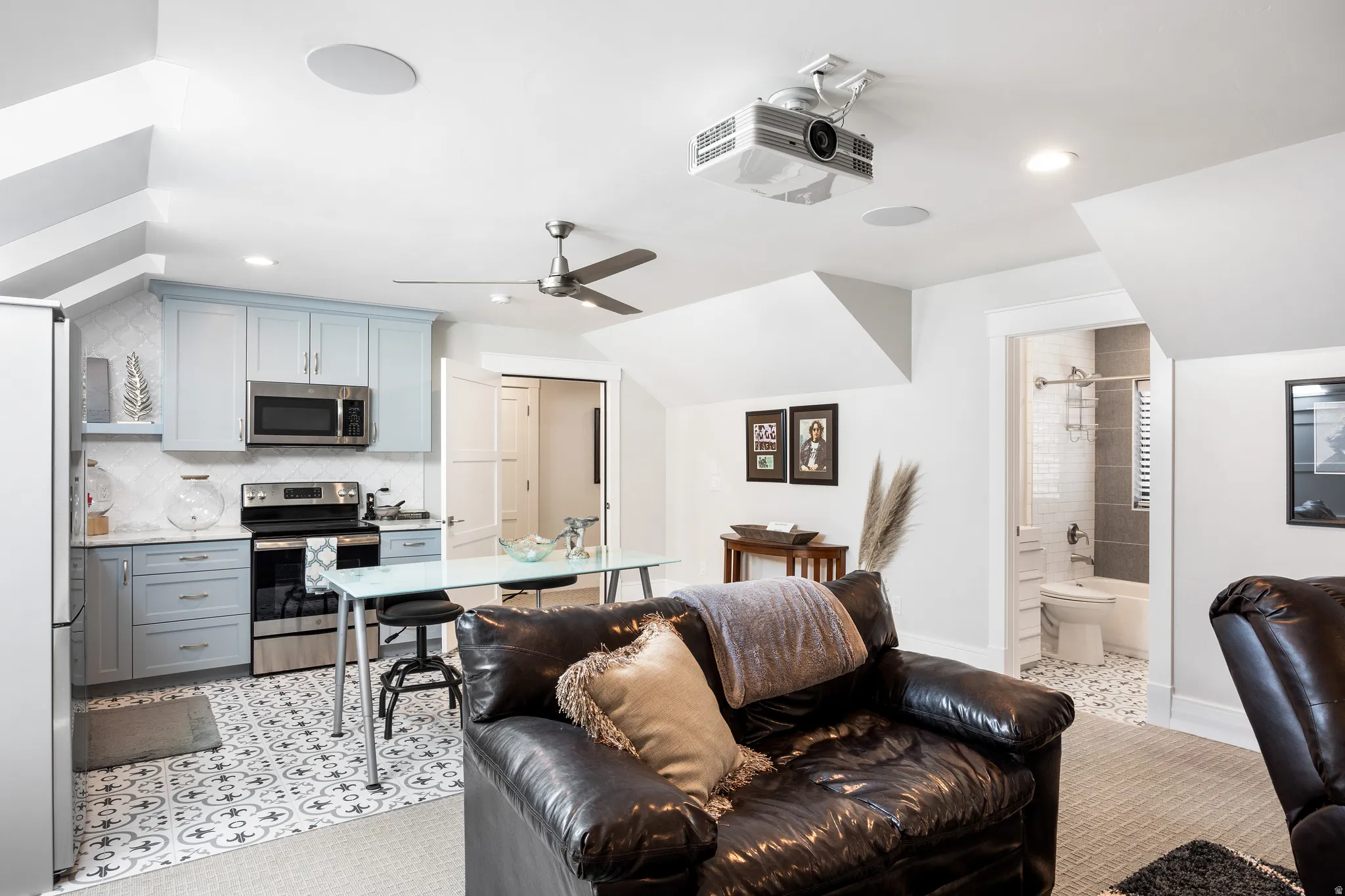 Living room with recessed lighting and ceiling fan