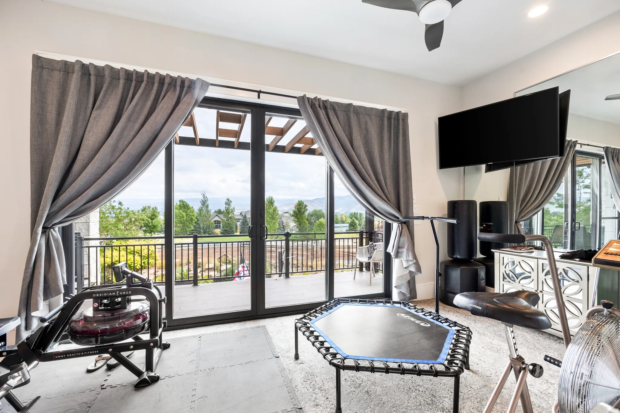 Workout area featuring ceiling fan