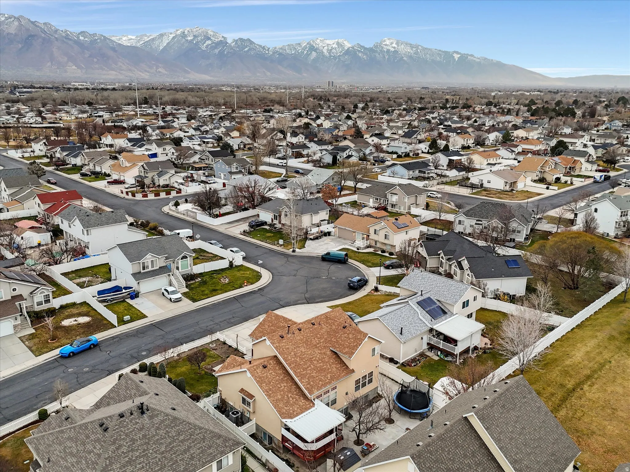 Aerial view of residential area featuring a mountain backdrop
