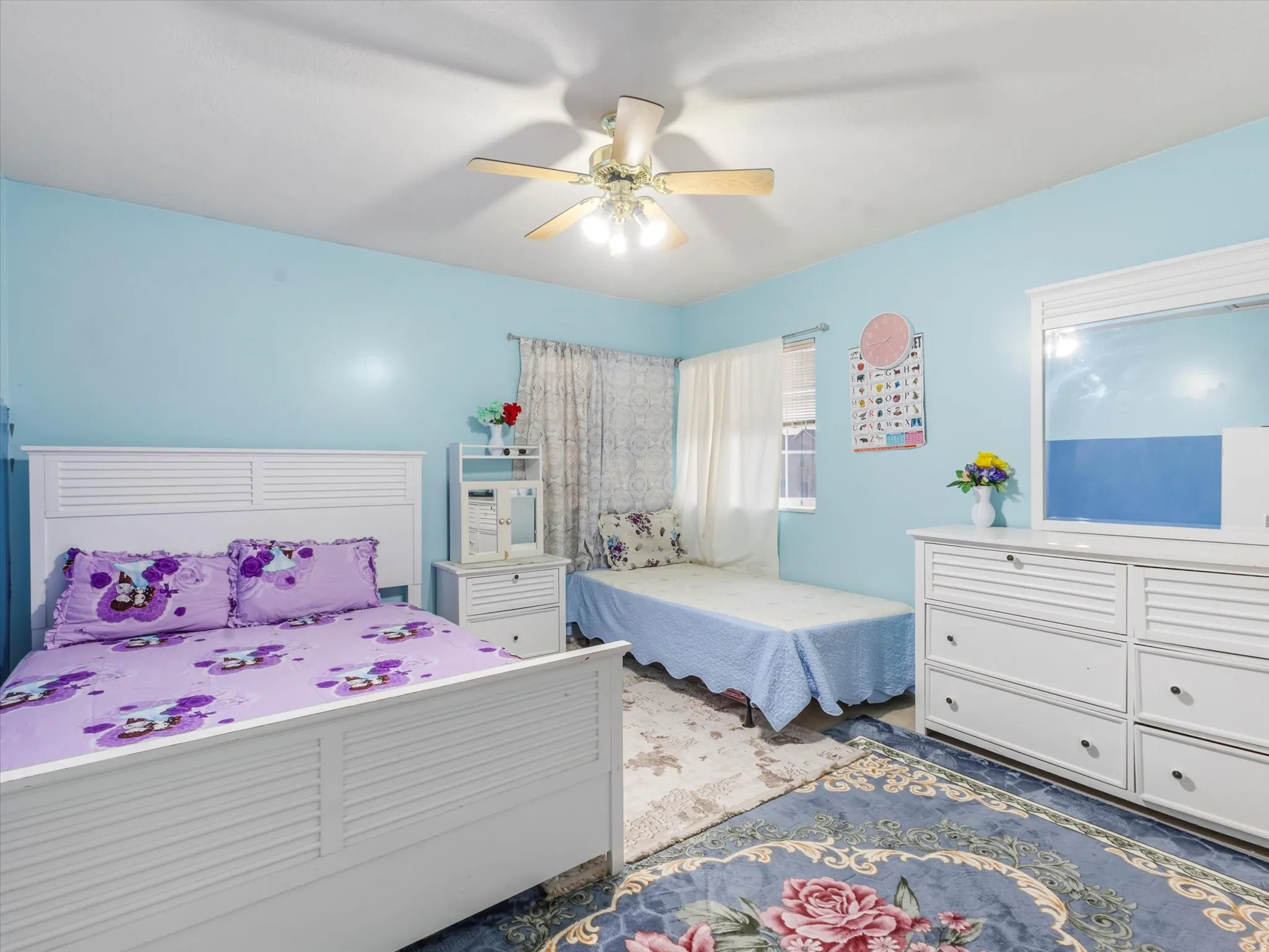 Bedroom featuring a ceiling fan