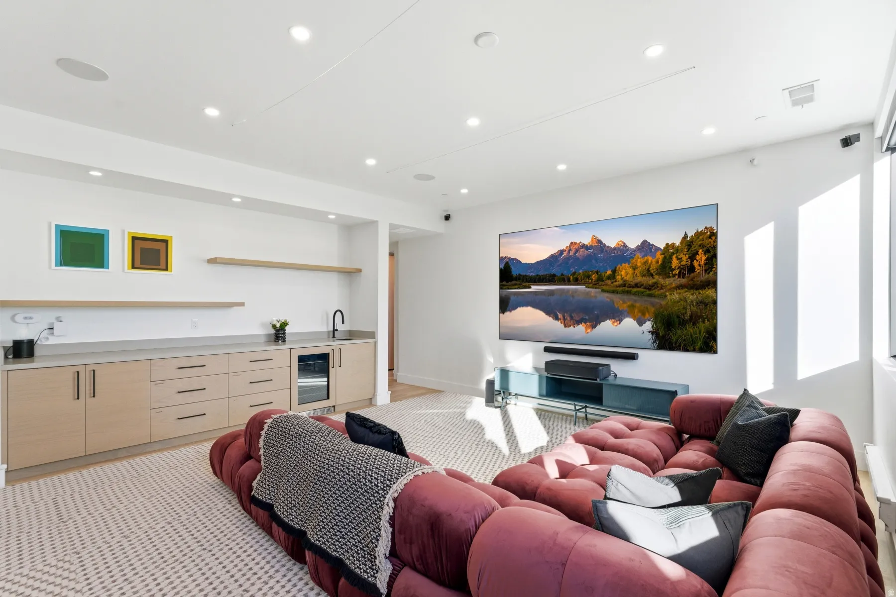 Living area featuring recessed lighting, wet bar, light colored carpet, and beverage cooler