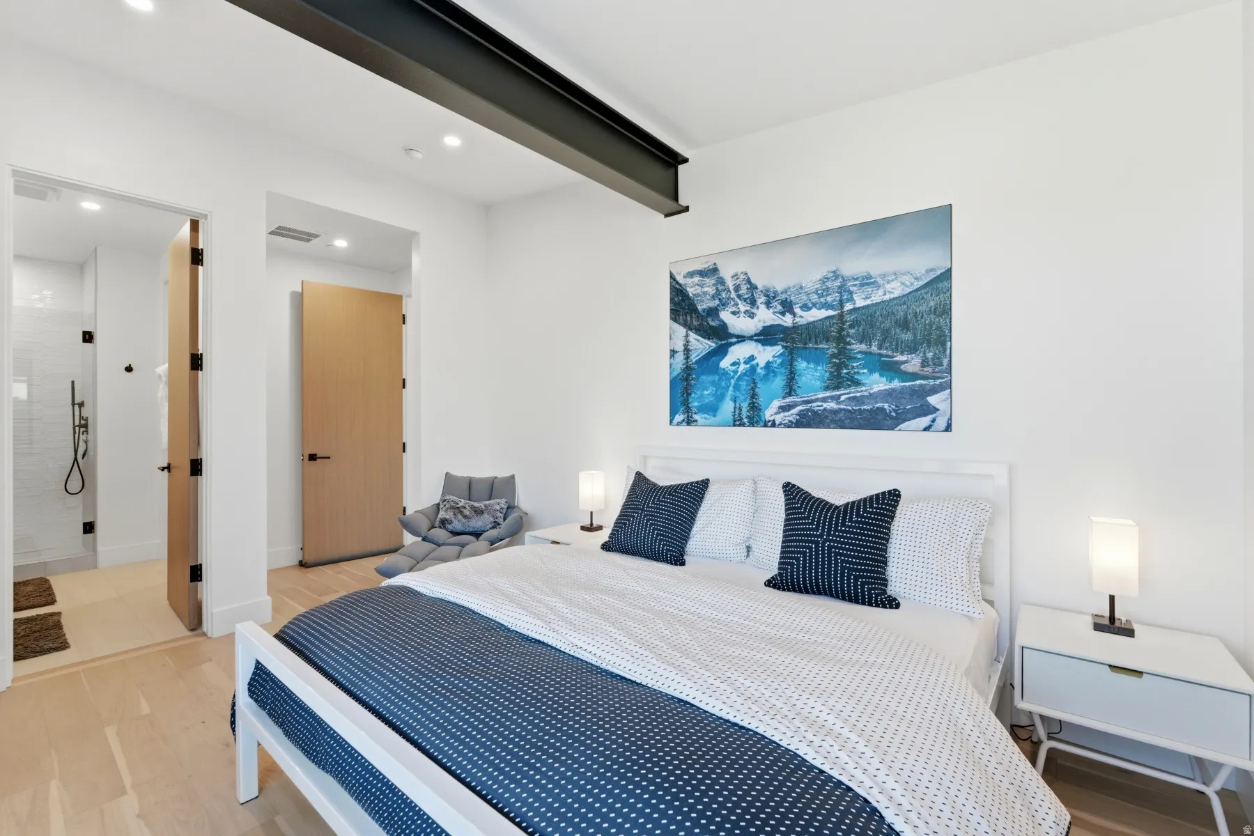 Bedroom with wood finished floors, recessed lighting, and beam ceiling
