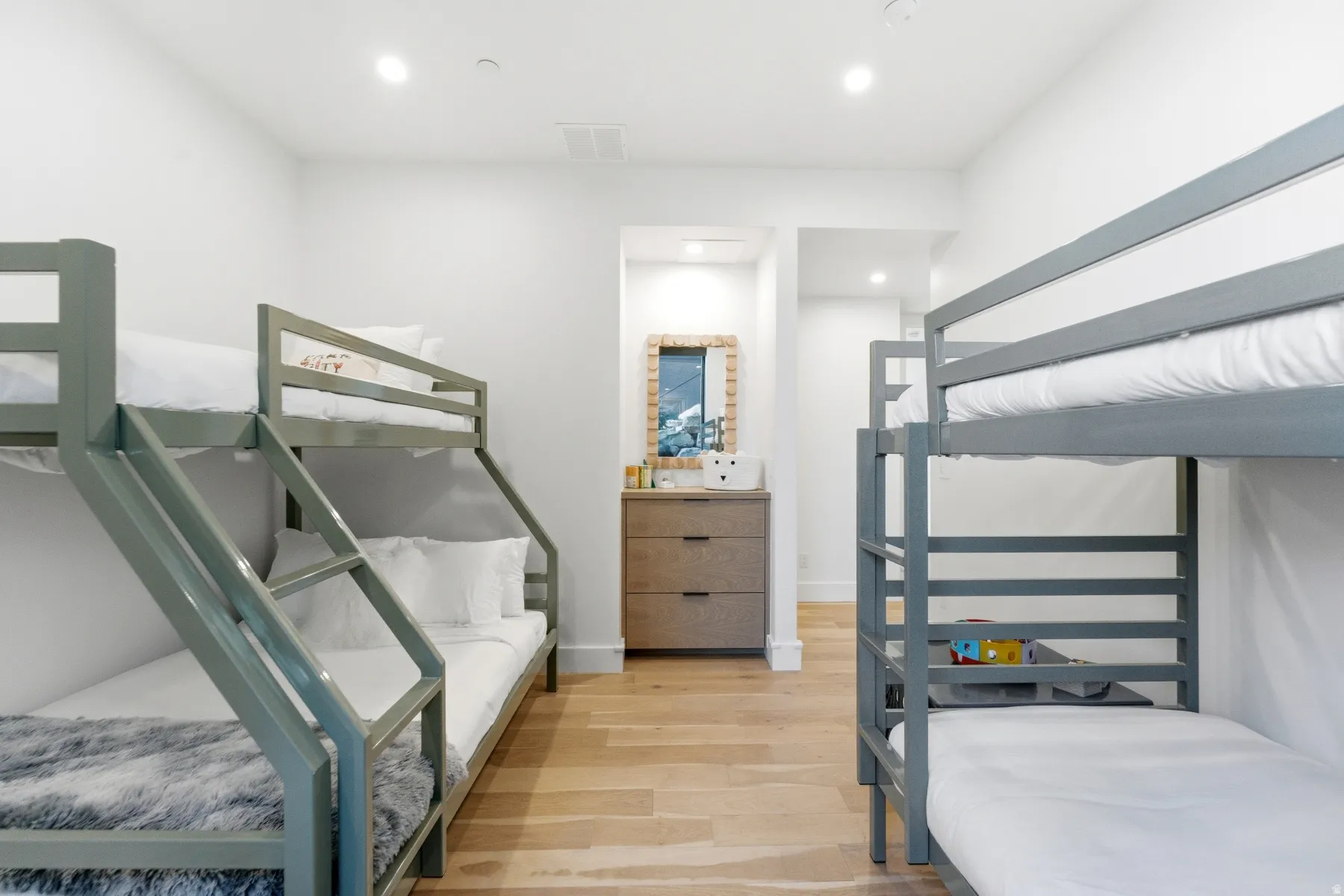 Bedroom with light wood-type flooring and recessed lighting