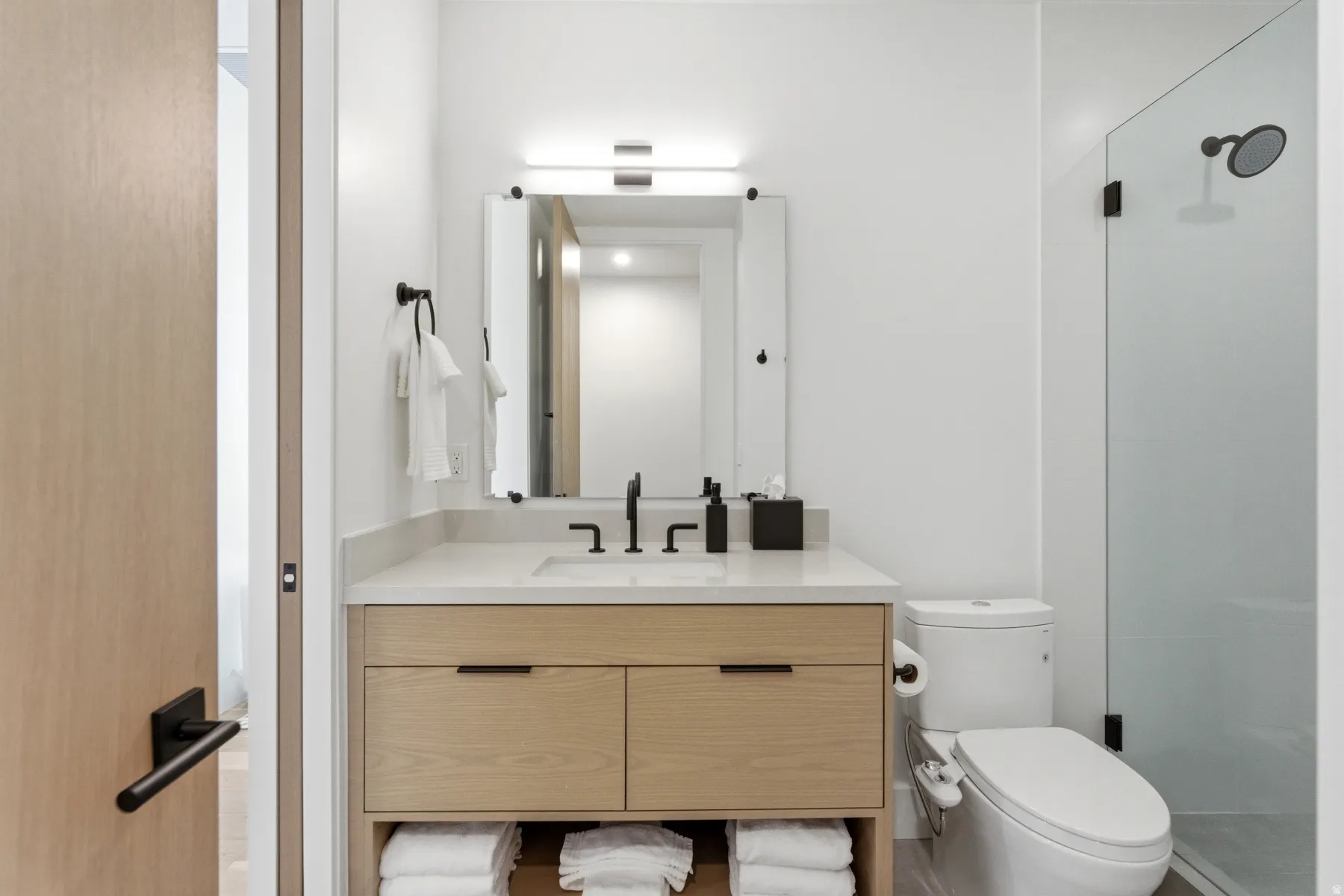 Bathroom with vanity and a stall shower