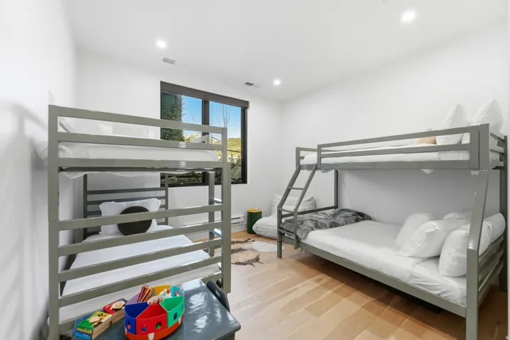 Bedroom with light wood-style floors