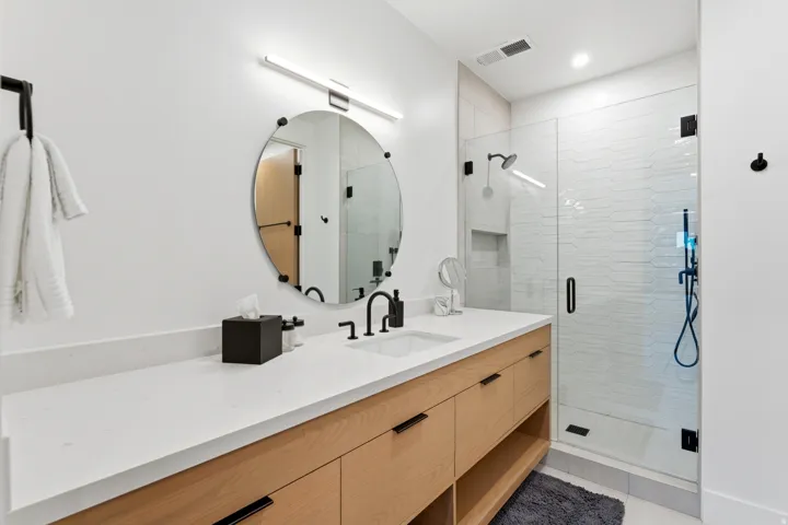 Full bath with a stall shower and vanity