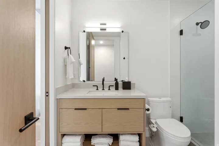 Bathroom with vanity and a stall shower