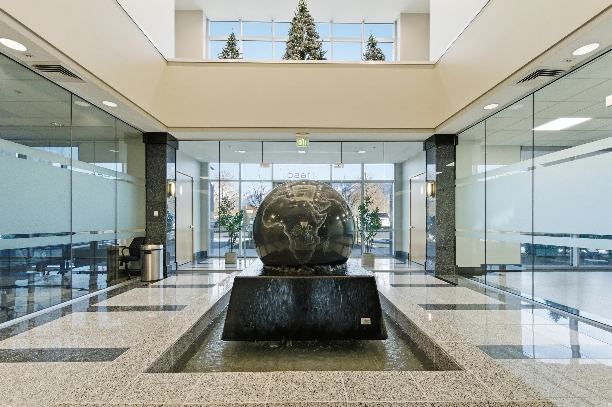Community lobby featuring a towering ceiling and recessed lighting
