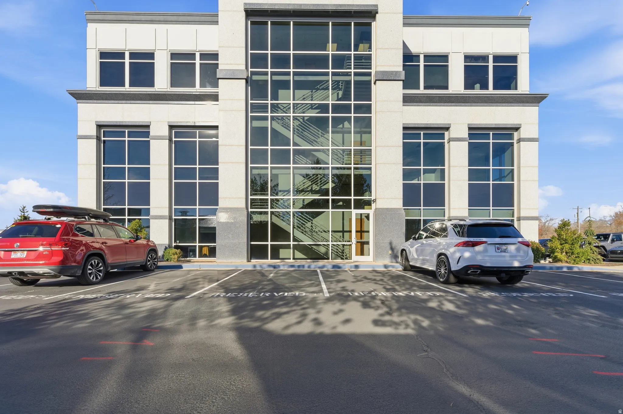 View of property featuring uncovered parking