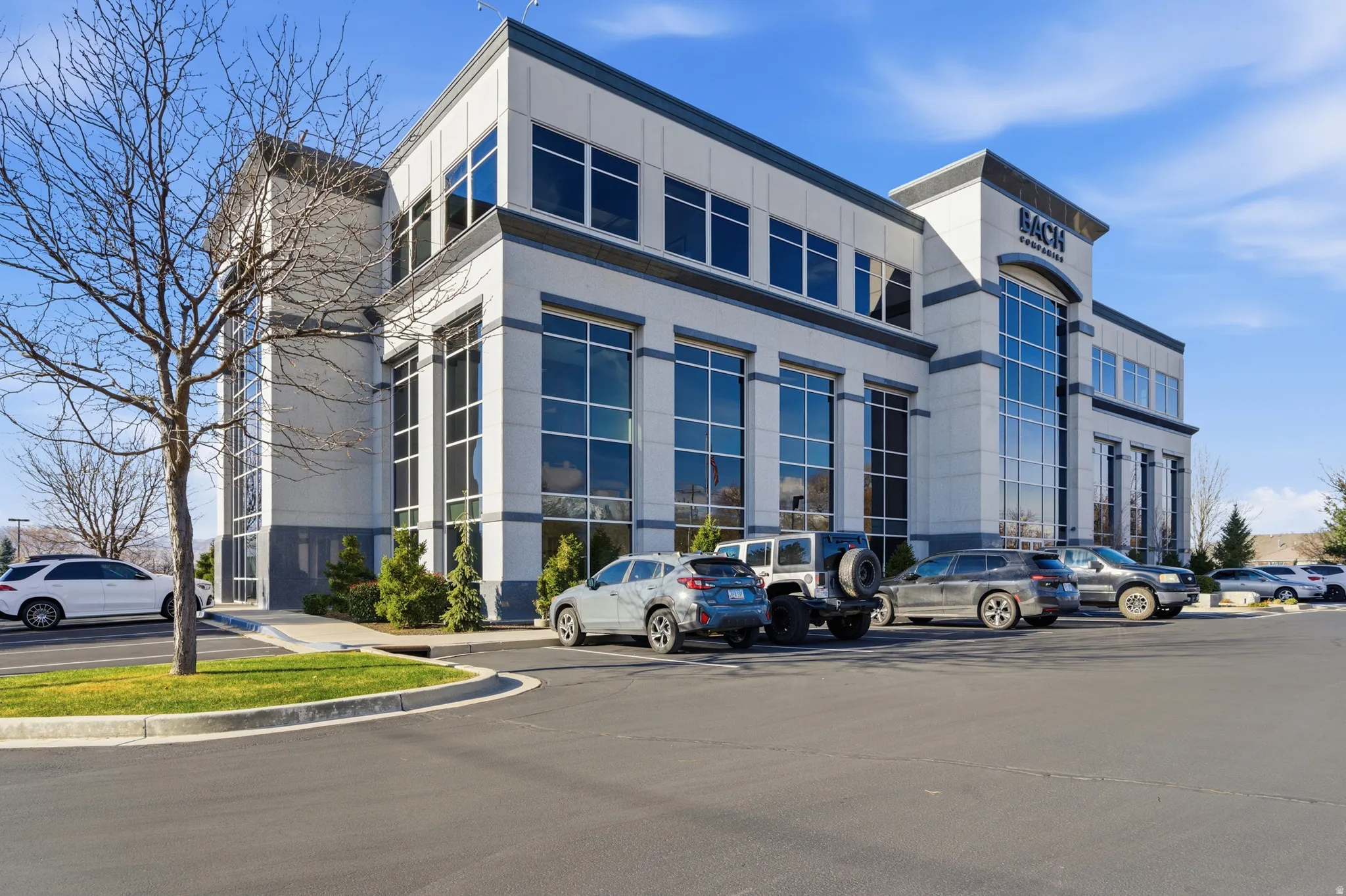 View of commercial location featuring uncovered parking