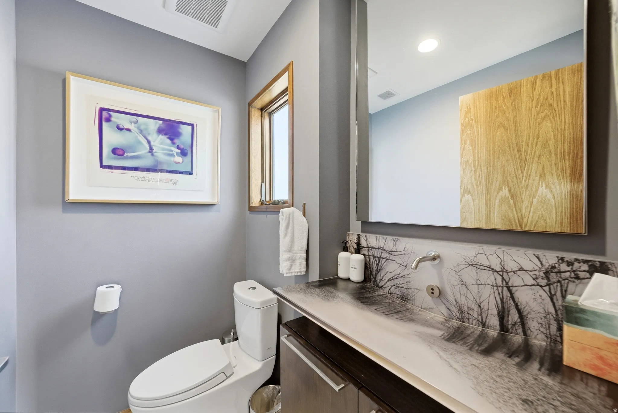 Half bath with vanity and toilet