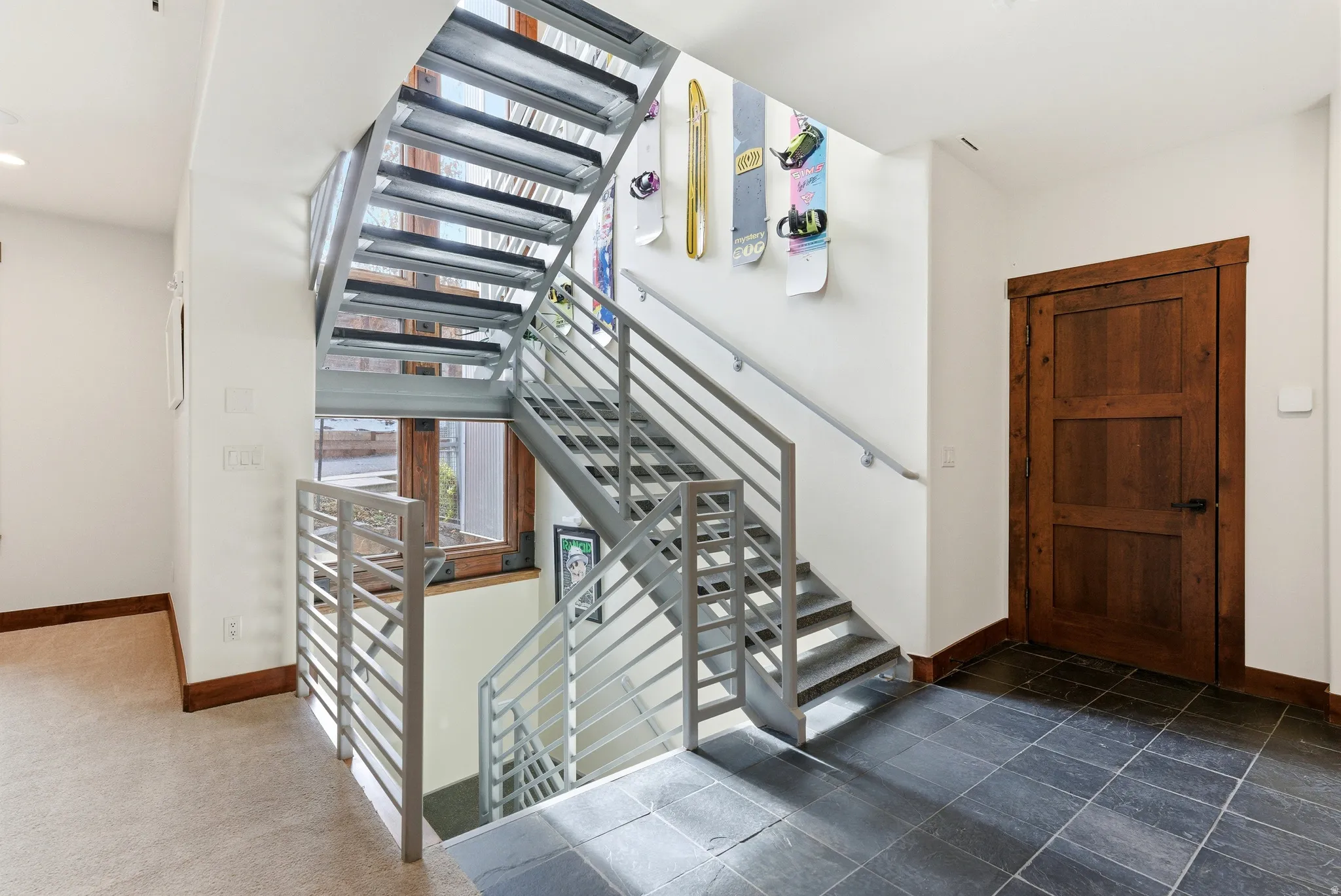 Staircase featuring baseboards