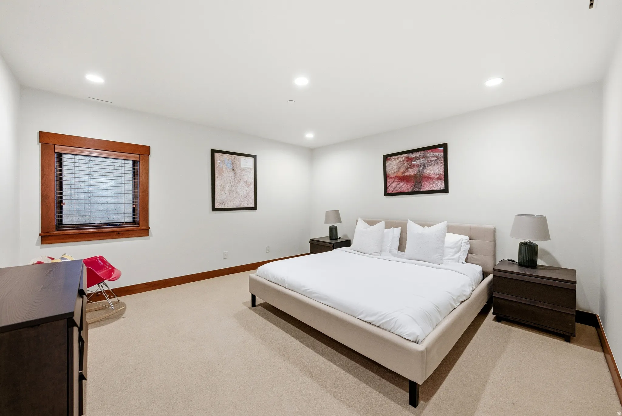 Bedroom with light carpet and recessed lighting