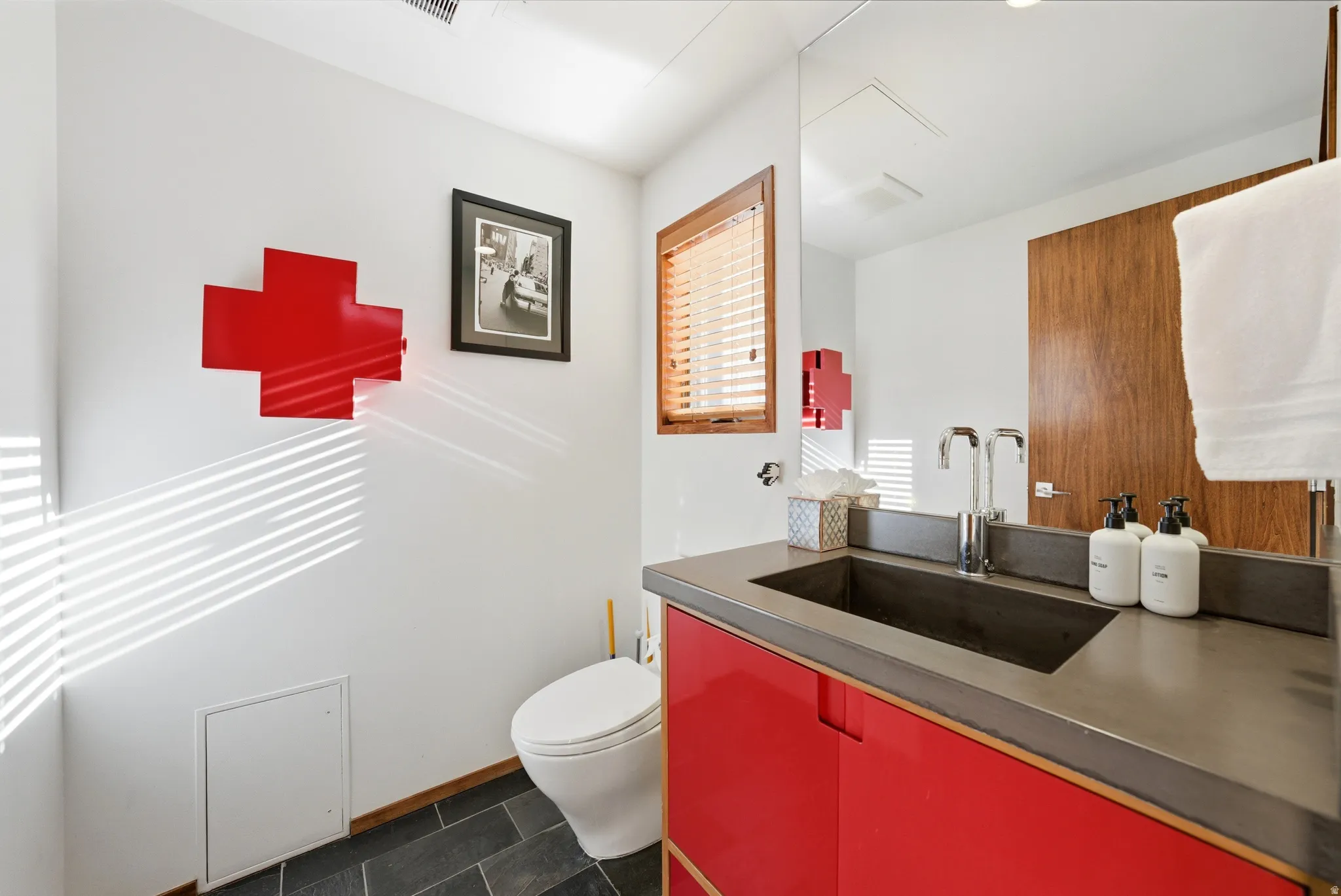 Half bath with vanity and toilet