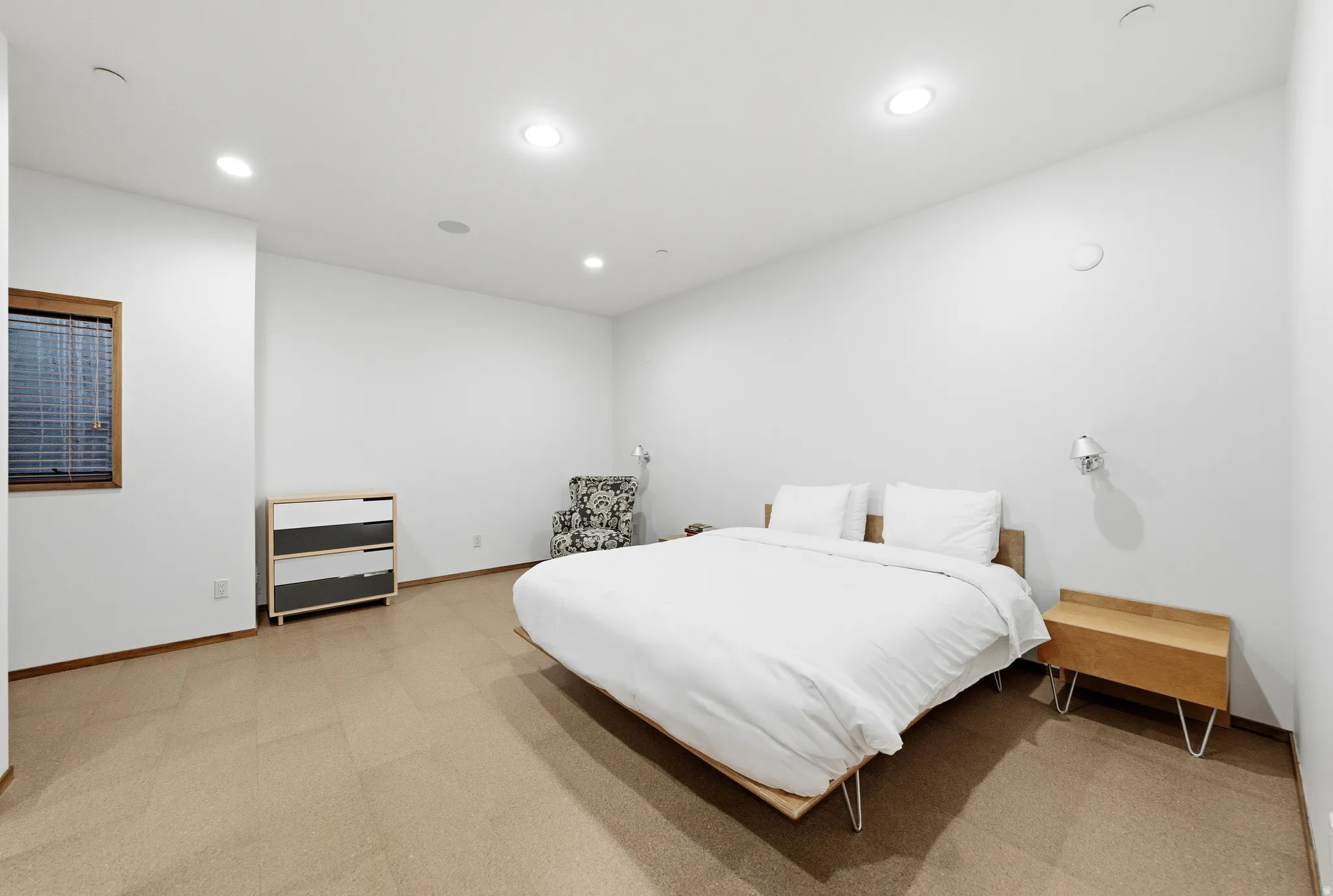 Bedroom with recessed lighting and light colored carpet