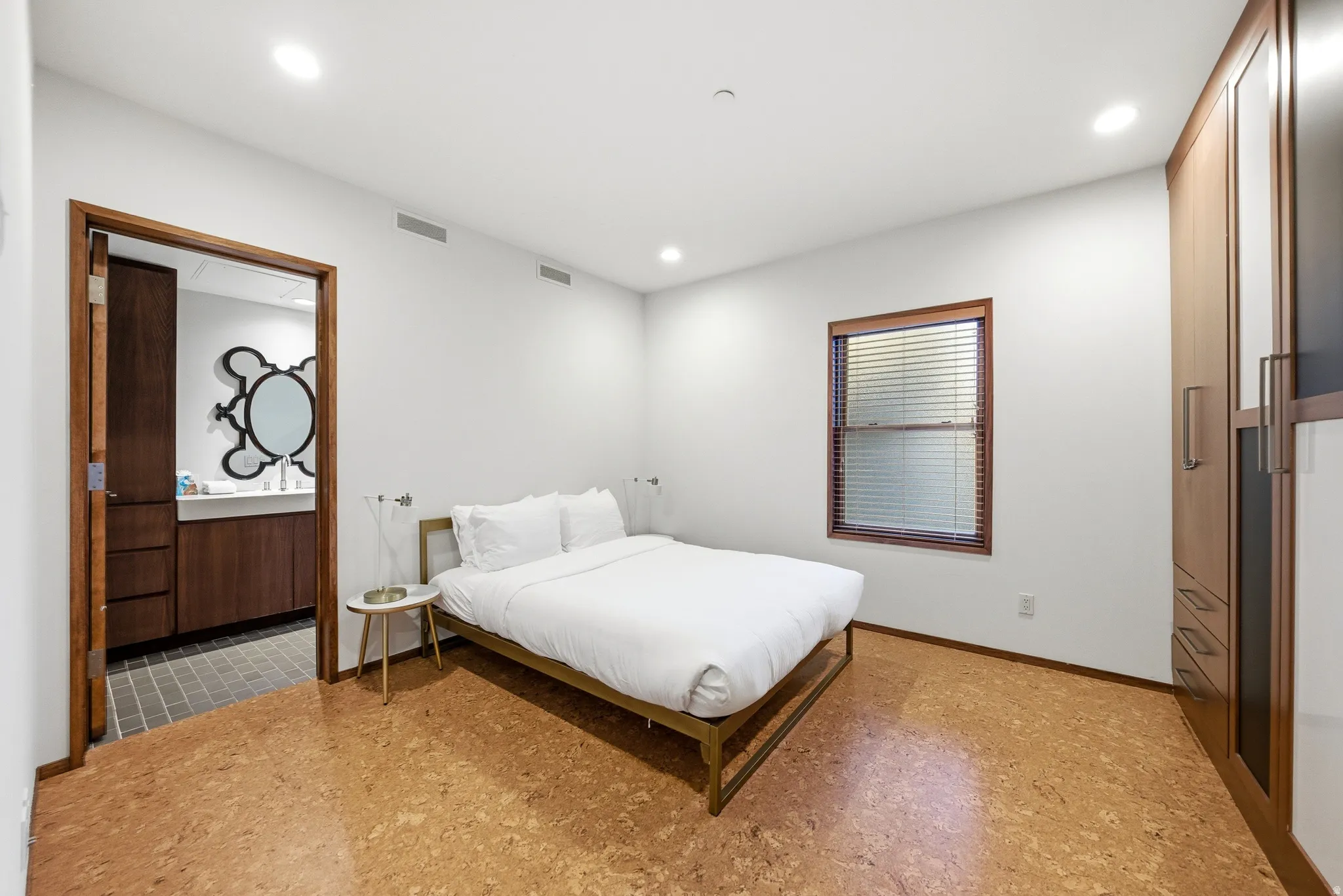 Bedroom featuring light flooring and recessed lighting