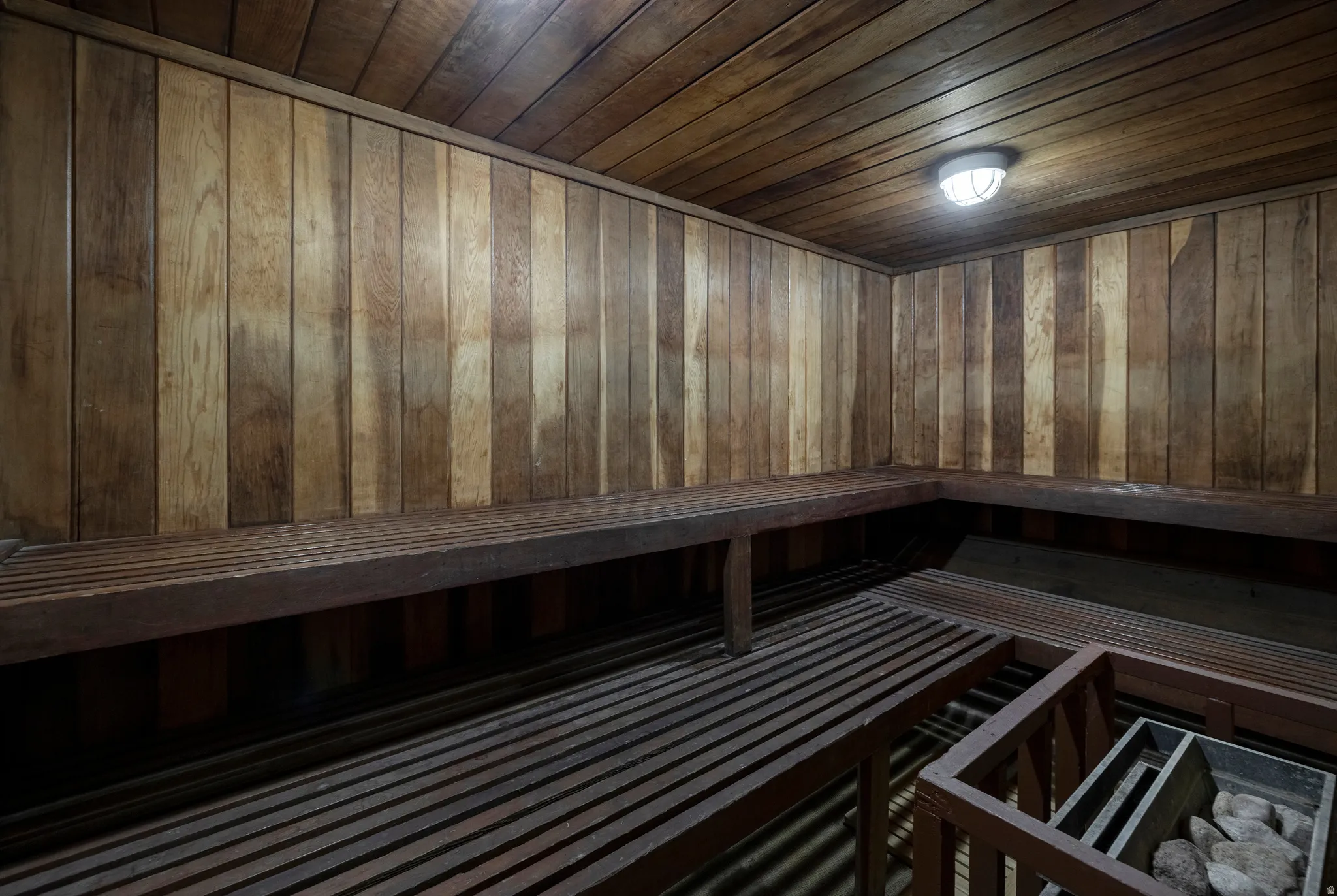 Relaxing sauna with wooden ceiling and wooden walls