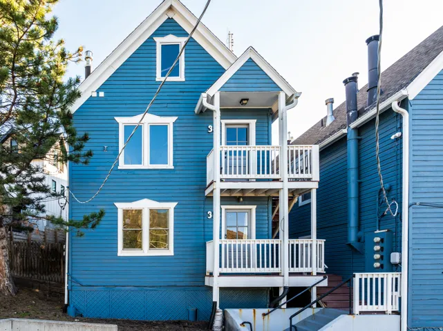 Rear view of property with a balcony