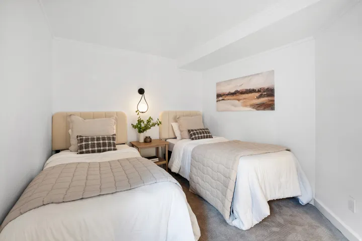 Carpeted bedroom featuring ornamental molding