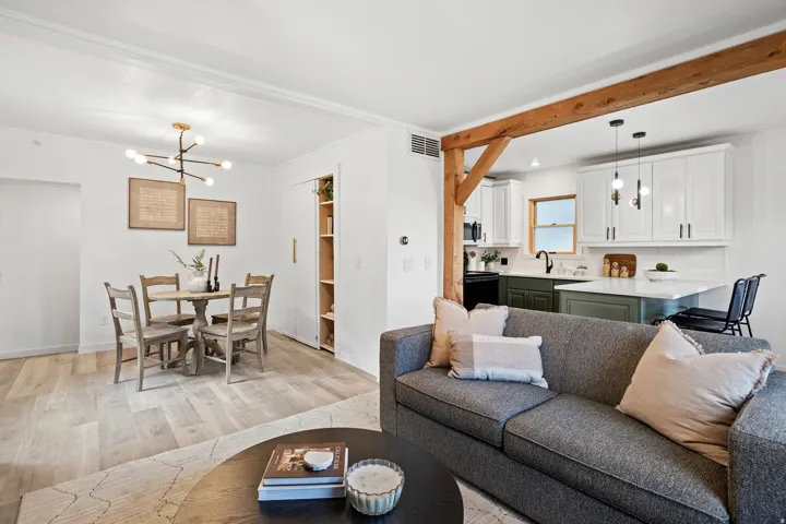 Living area featuring a chandelier and light wood-style floors