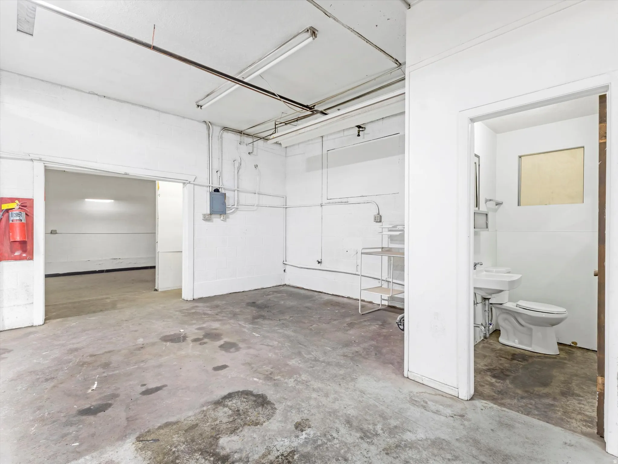 Miscellaneous room featuring concrete flooring