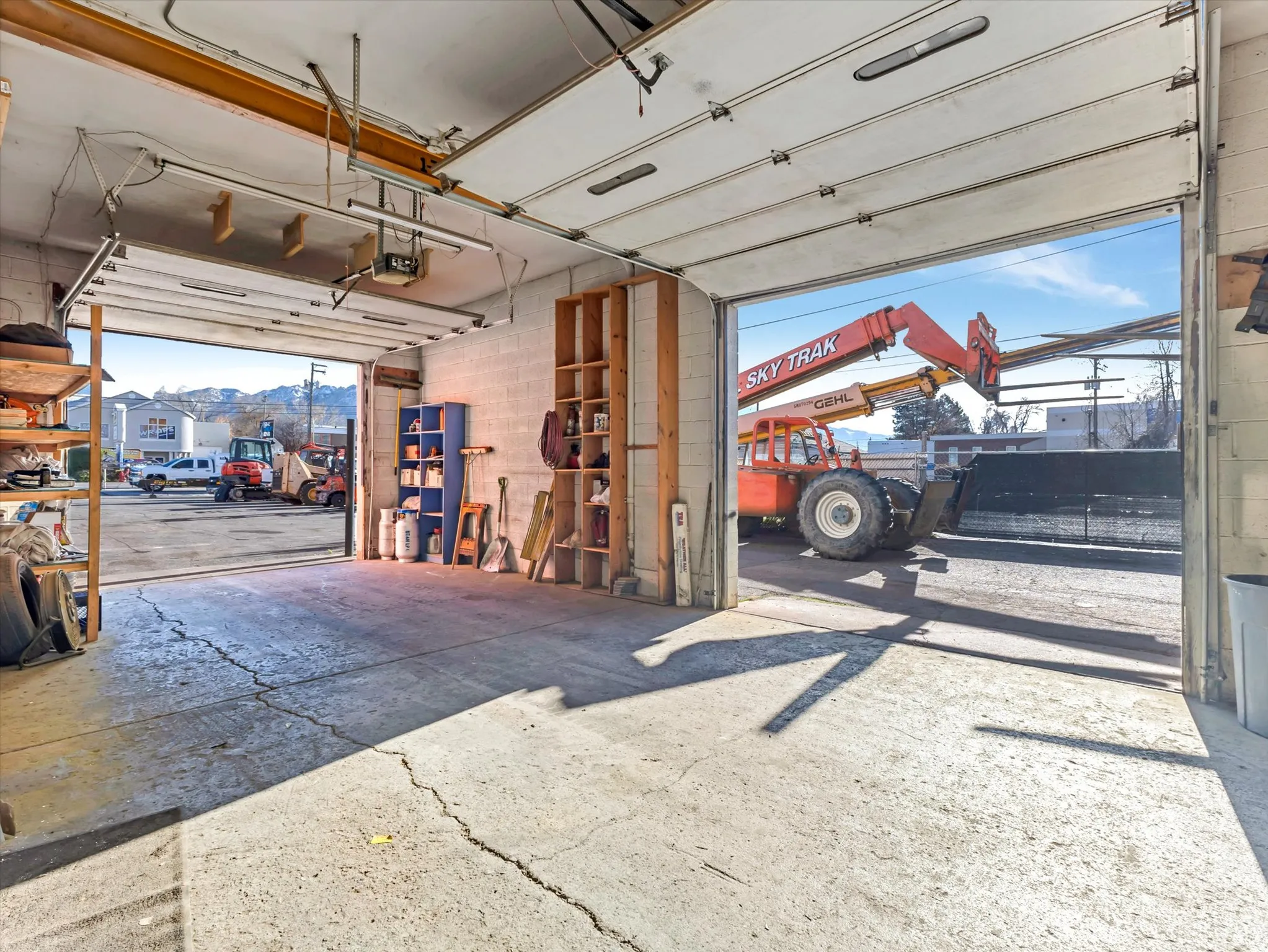 Garage featuring concrete block wall