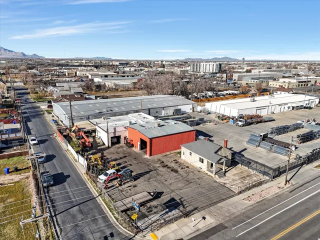Aerial view of an industrial area and a mountainous background