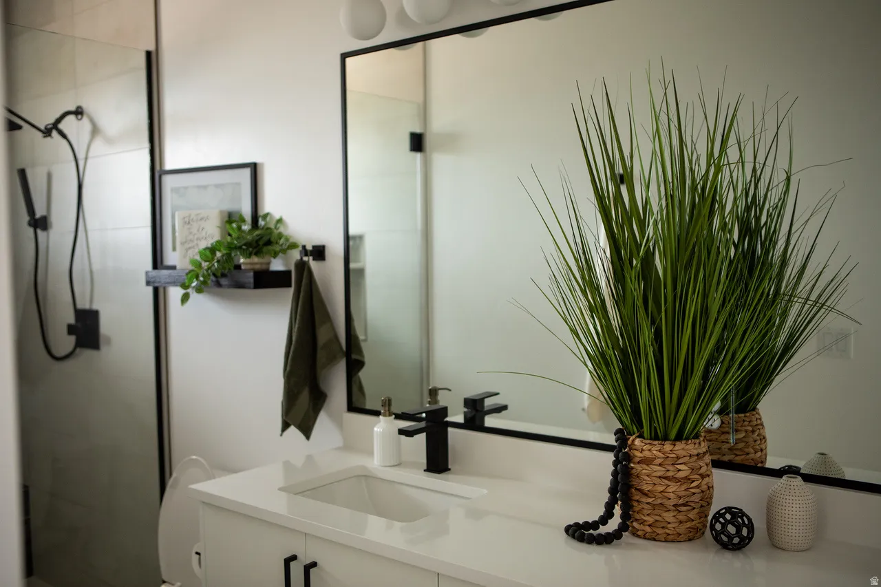 Bathroom featuring vanity and a shower stall
